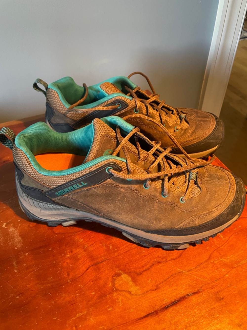 Merrell dark earth, performance Trail Shoes with Teal Interior women’s size 9